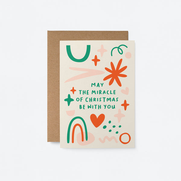 Christmas card with red, green, pink figures with a text that says may the miracle of christmas be with you
