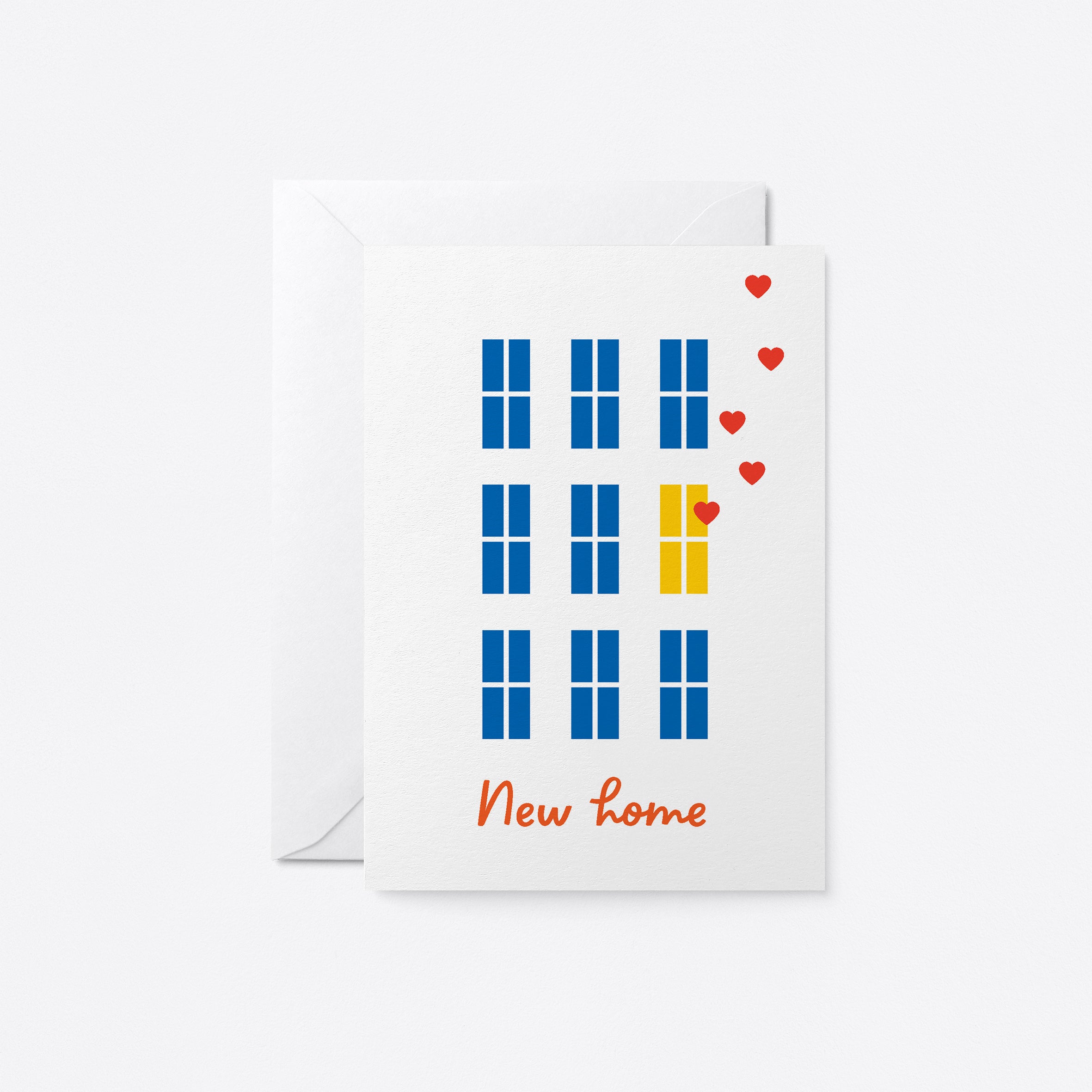 housewarming card with blue windows and yellow windows with floating red hearts with a text that says new home