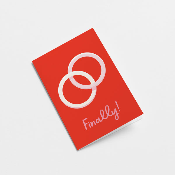 wedding card with two white rings one within the other and a text that says finally  Edit alt text