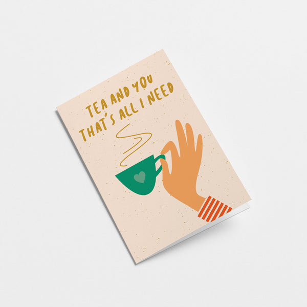 friendship card with a hand holding a green tea cup and a text that says tea and you that’s all i need  Edit alt text