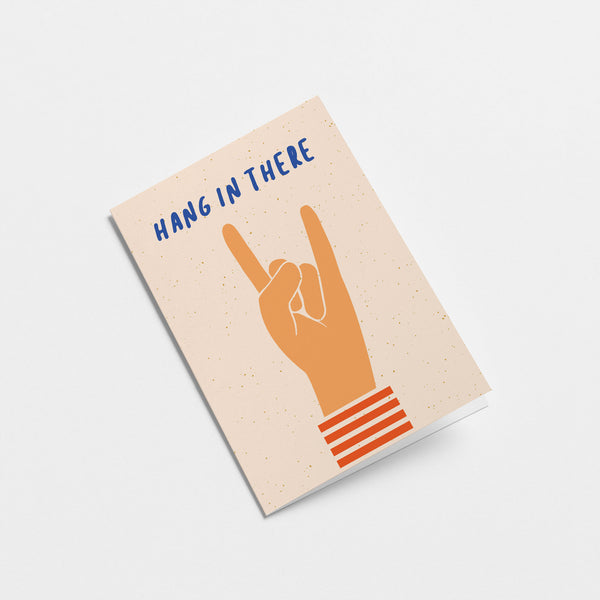 encouragement card with a hand and a gesture of sign of the horns with a text that says hang in there  Edit alt text