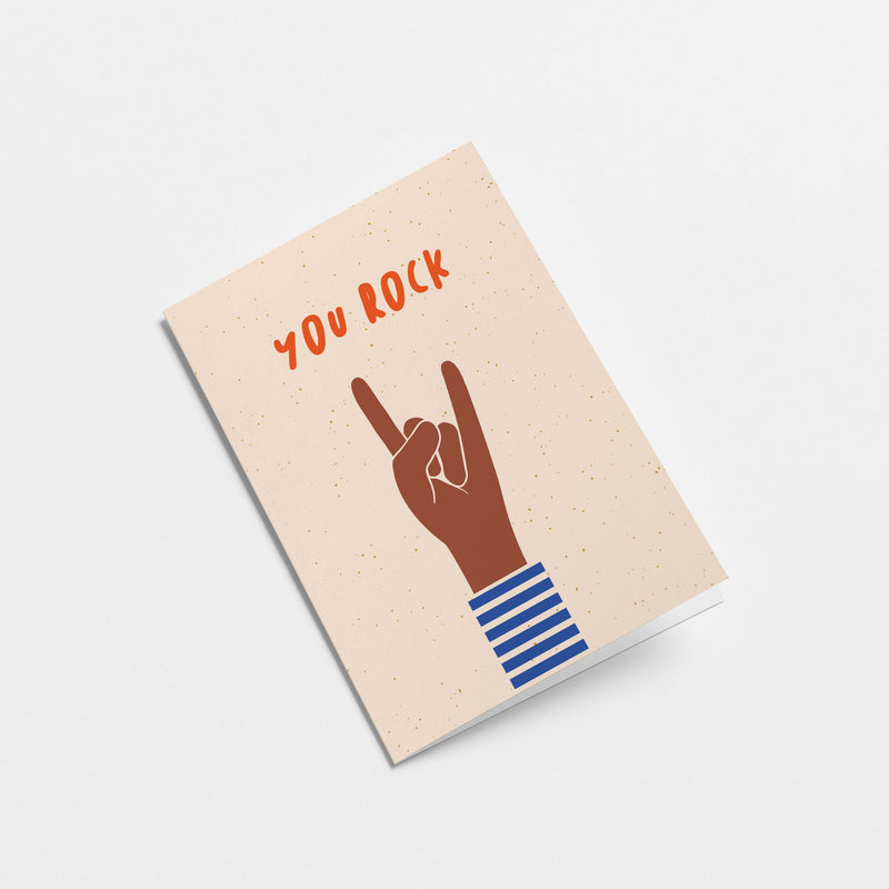birthday card with a brown hand and a gesture of sign of the horns with a text that says you rock  Edit alt text