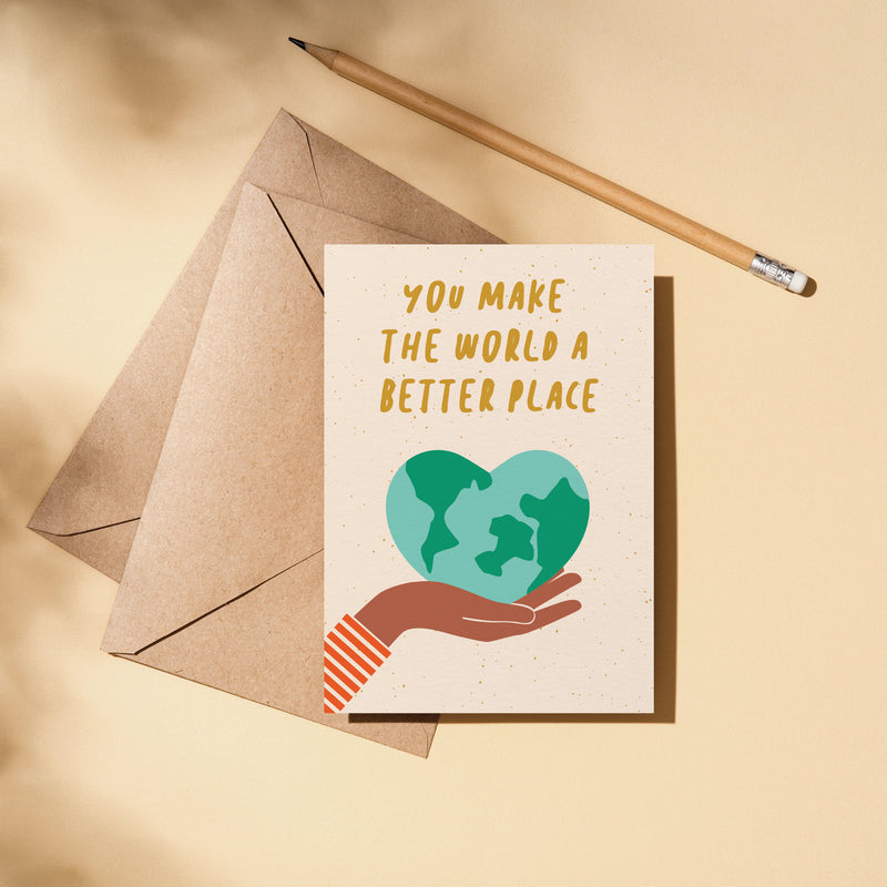 friendship card with a heart shaped earth on the palm of a hand with a text you make the world a better place  Edit alt text