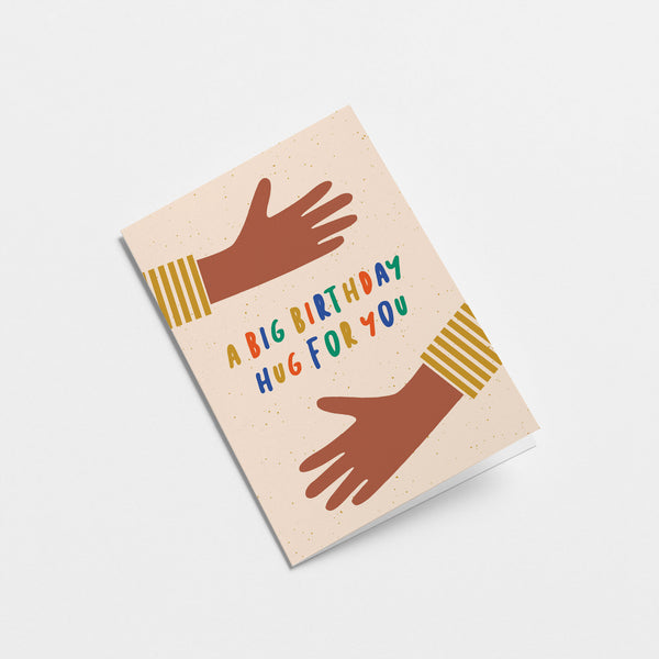 birthday card with two brown arms hugging with a text that says a big birthday hug for you  Edit alt text