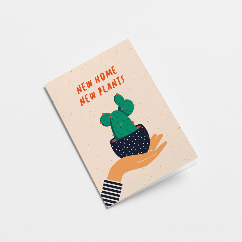 housewarming card with a hand holding a black flowerpot with a cactus in it and a text that says new home new plants  Edit alt text