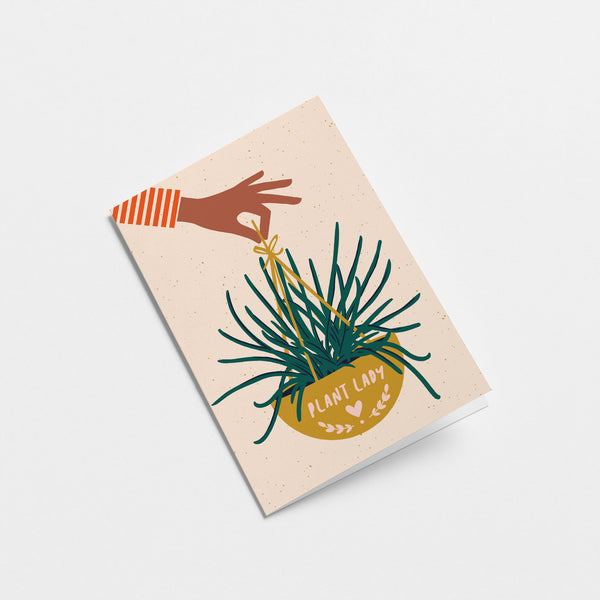 housewarming card with a hand holding yellow plant basket with a text that says plant lady  Edit alt text