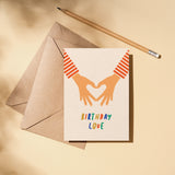 birthday card with 2 hands making heart shape with fingers and a text that says birthday love  Edit alt text
