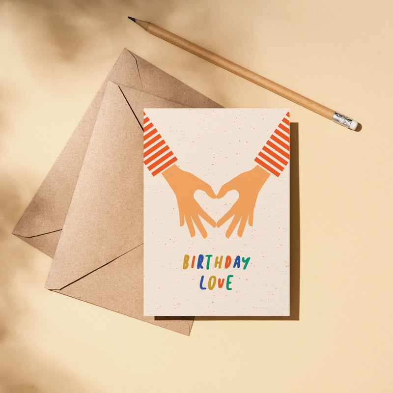 birthday card with 2 hands making heart shape with fingers and a text that says birthday love  Edit alt text