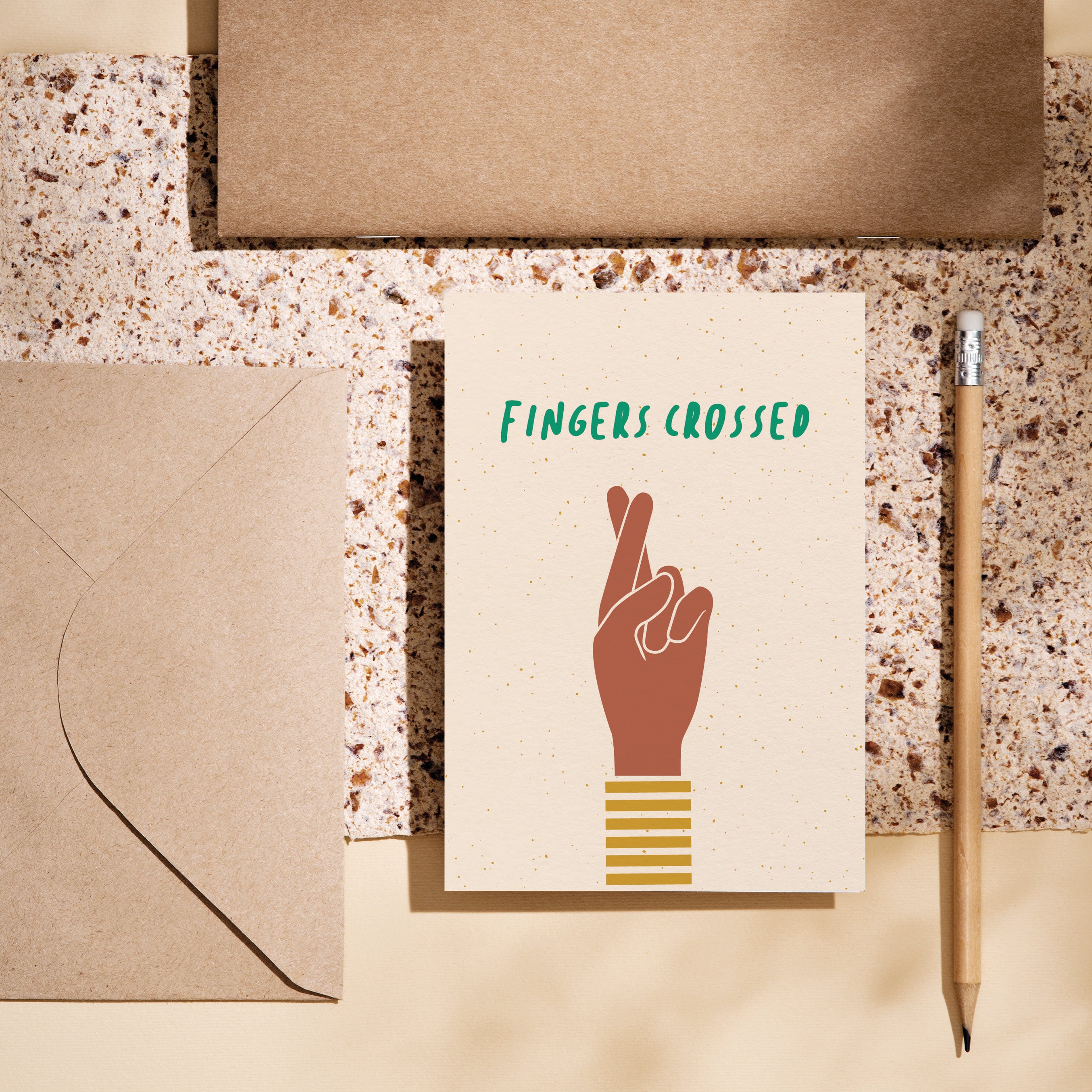 Good luck card with brown fingers crossed hand gesture and a text that says fingers crossed  Edit alt text