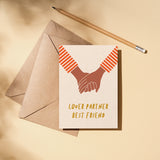 Love Card with 2 brown hands holding each other and a text that says lover partner best friend  Edit alt text