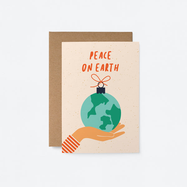 greeting card with gift wrapped earth on the palm of a hand with a text that says peace on earth