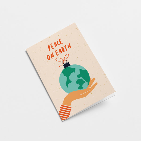 greeting card with gift wrapped earth on the palm of a hand with a text that says peace on earth  Edit alt text