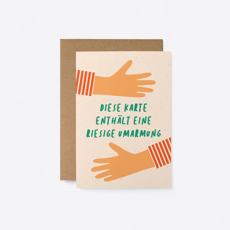 German greeting card with two arms hugging with a text of Diese Karte enthält eine riesige Umarmung