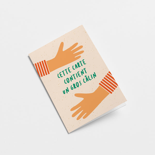 french greeting card with two arms hugging with a text of Cette carte contient un gros câlin  Edit alt text