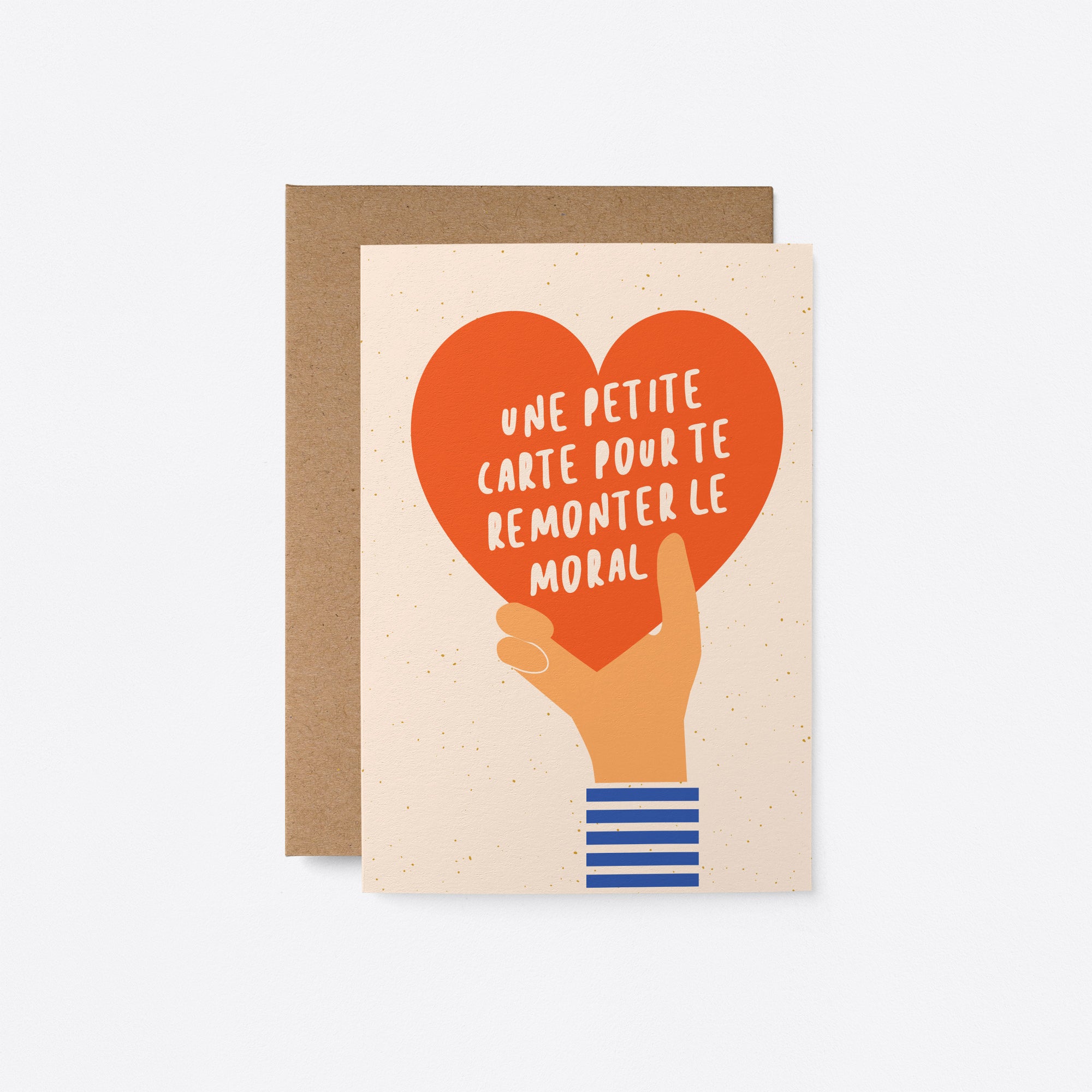 french greeting card with a hand holding red heart and a text inside the heart that says Une petite carte pour te remonter le moral Bisous