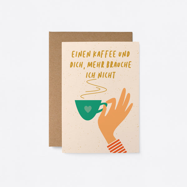 German friendship card with a hand holding a green tea cup and a text that says Einen kaffee und dich, mehr brauche ich nicht