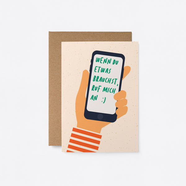 German Friendship card with a hand holding a cell phone with a text in it that says Wenn du etwas brauchst, ruf mich an