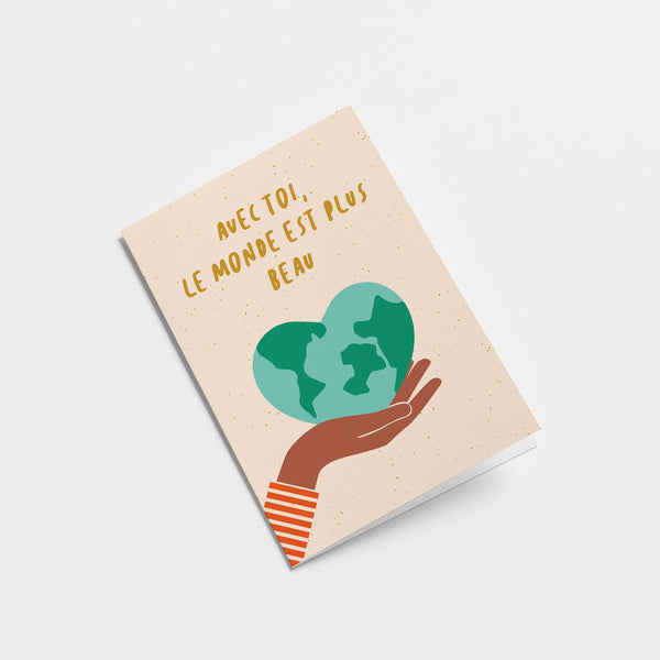 french friendship card with a heart shaped earth on the palm of a hand with a text Avec toi, le monde est plus beau  Edit alt text