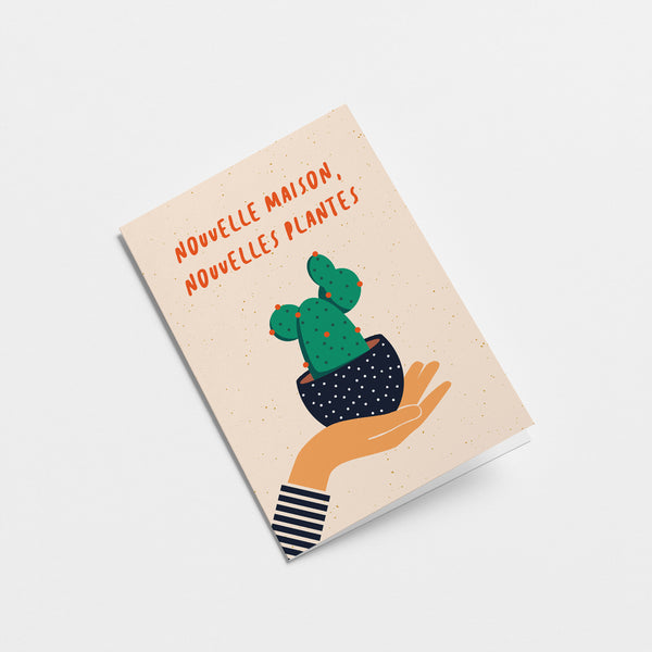 french housewarming card with a hand holding a black flowerpot with a cactus in it and a text that says Nouvelle maison, nouvelles plantes