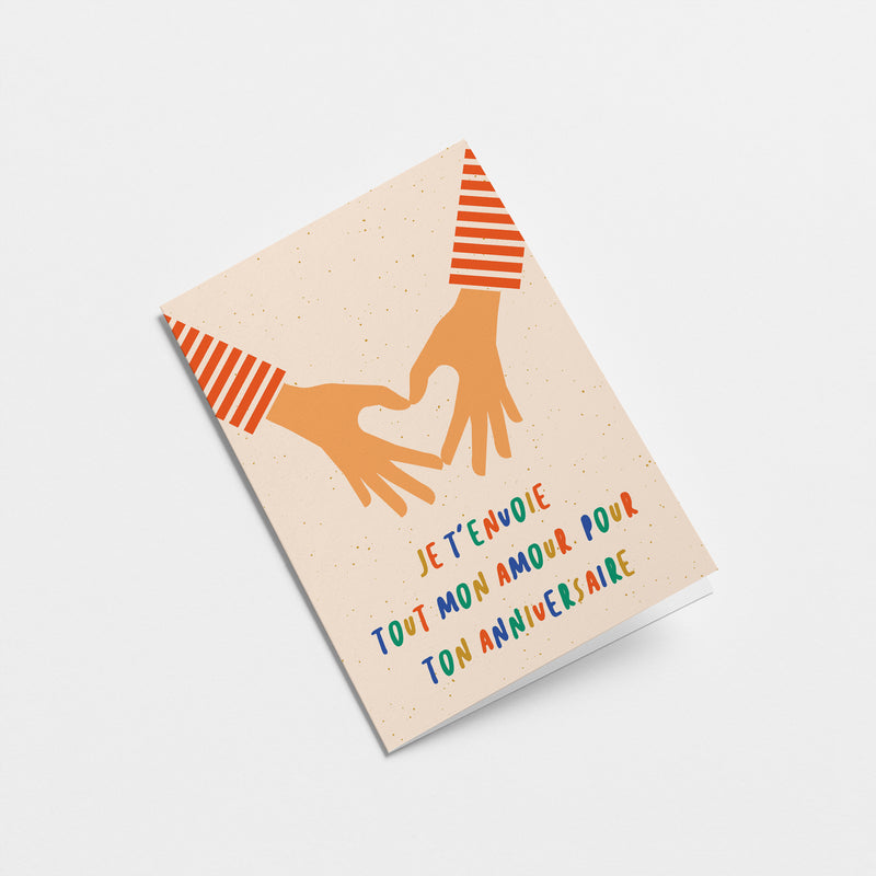 french birthday card with 2 hands making heart shape with fingers and a text that says Je t’envoie tout mon amour pour ton anniversaire  Edit alt text