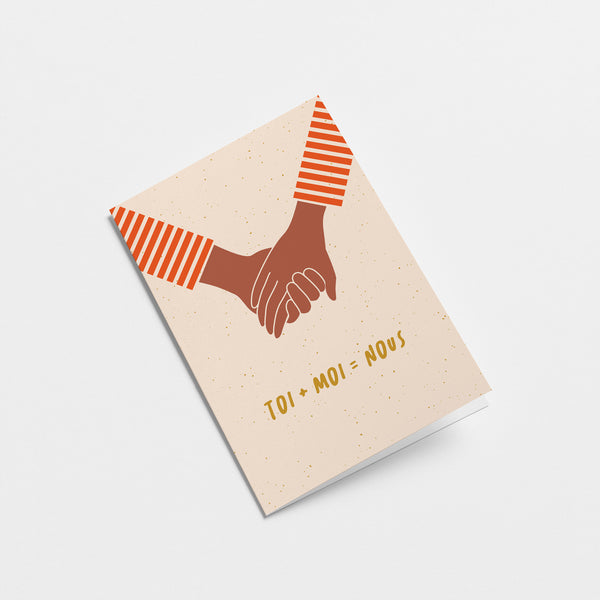 french Love Card with 2 brown hands holding each other and a text that says Toi + moi = nous  Edit alt text