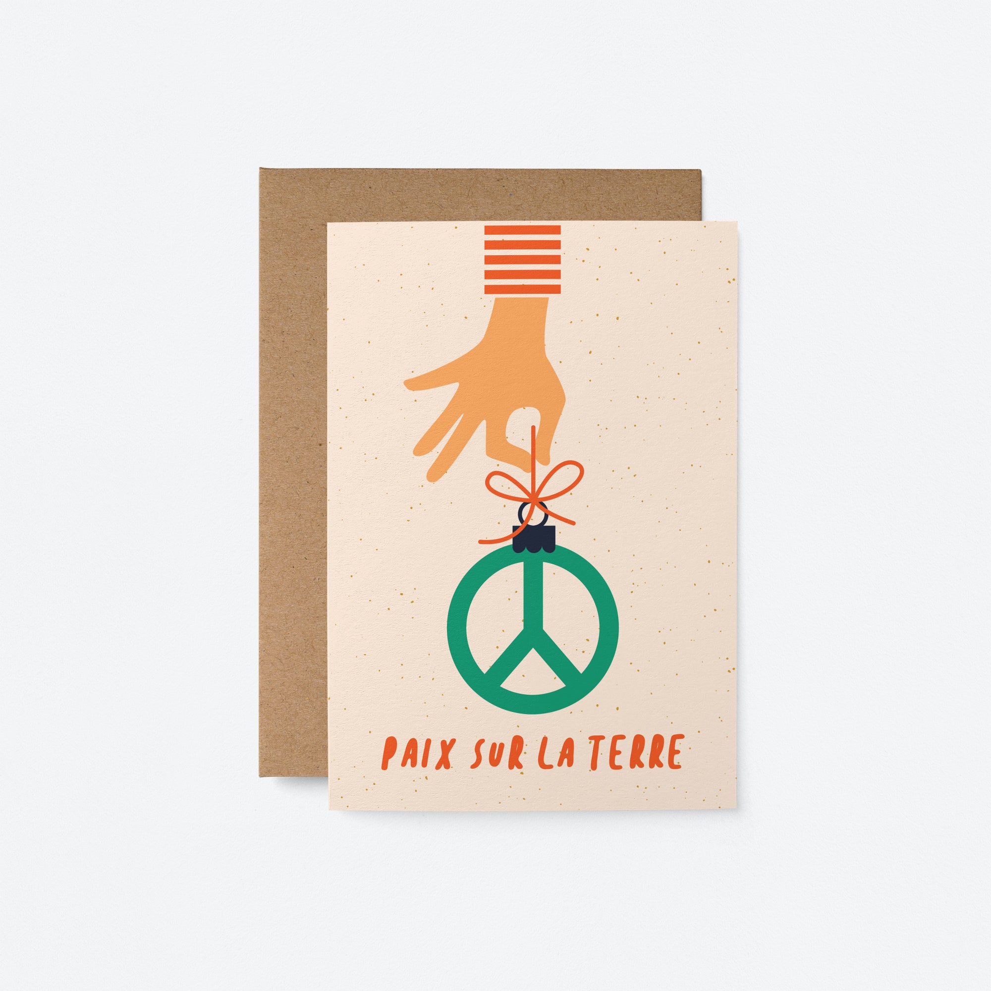 french christmas card with a hand holding a peace figure and a text that says Paix sur la Terre