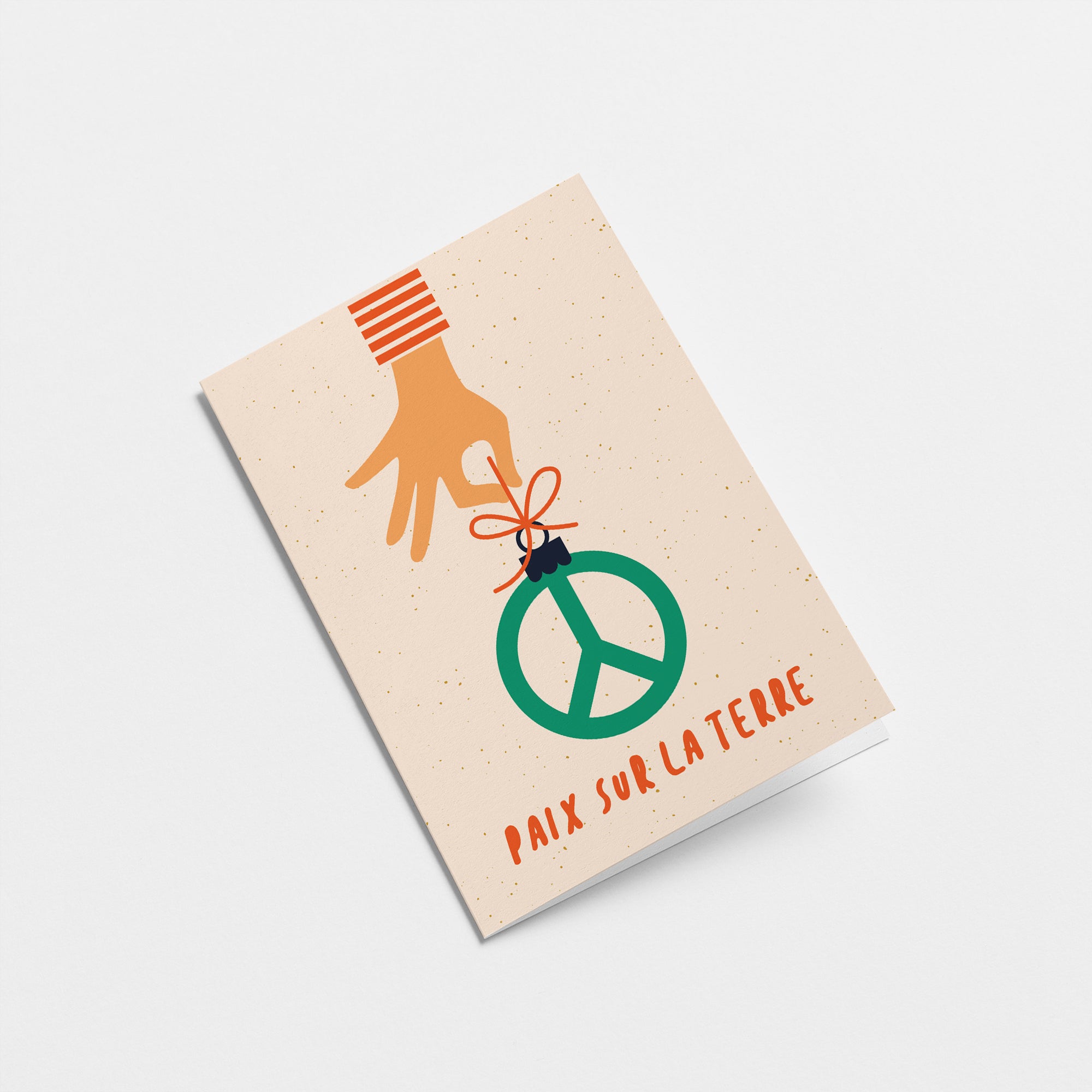 french christmas card with a hand holding a peace figure and a text that says Paix sur la Terre  Edit alt text