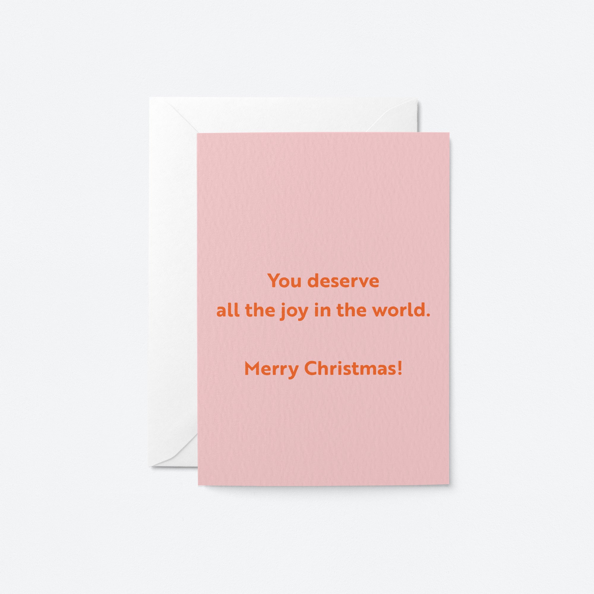 christmas card with a text that says You deserve all the joy in the world. Merry Christmas!