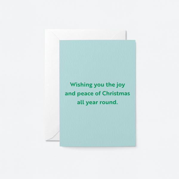 christmas card with a text that says Wishing you the joy and peace of Christmas all year round