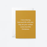christmas card with a text that says i love sharing love and life with you. May all your wishes come true this Christmas.