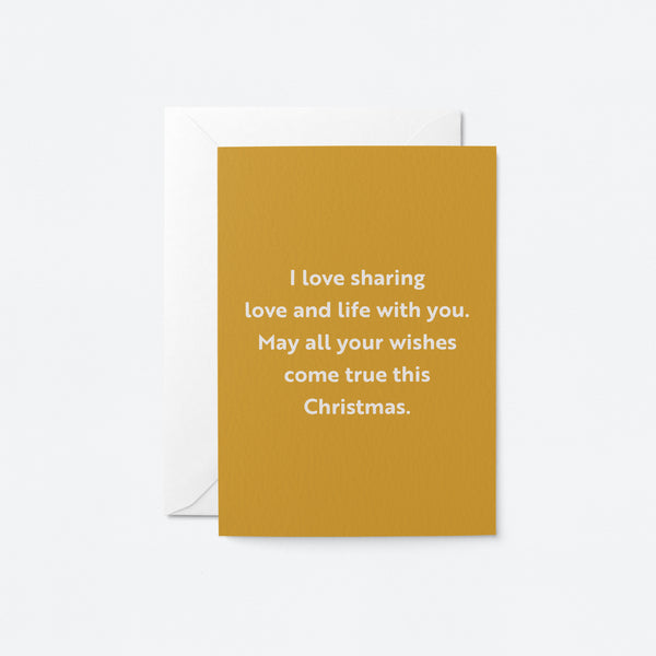 christmas card with a text that says i love sharing love and life with you. May all your wishes come true this Christmas.